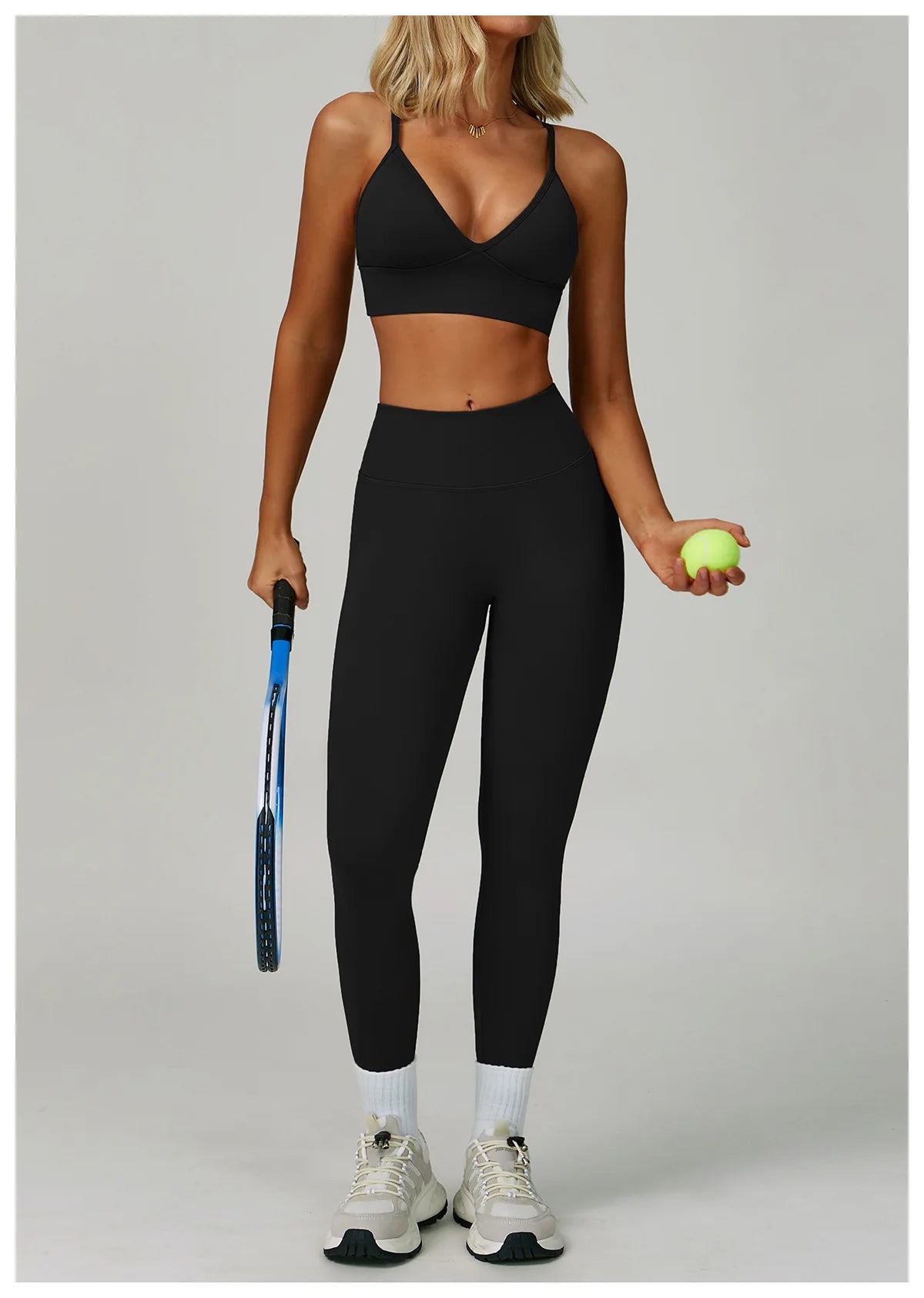 Seamless black 2/3-piece sports yoga set by Corporación Turística, includes sports bra and leggings, designed for active wear.