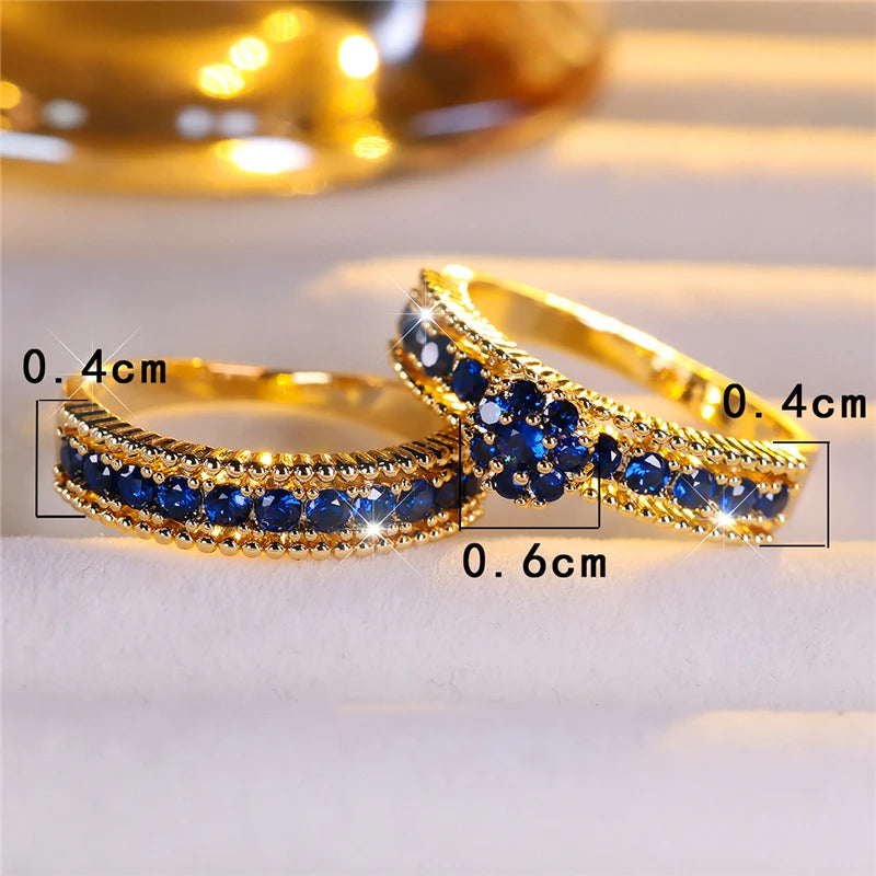 Set of turquoise cubic zirconia engagement rings by Corporación Turística, featuring sparkling stones and elegant band designs.