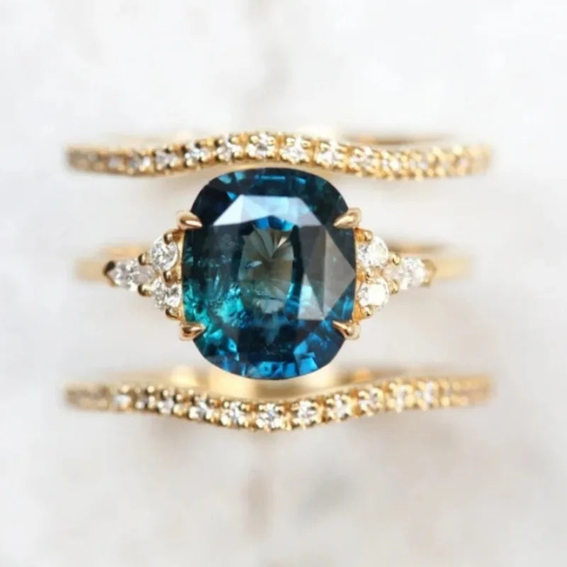 Silver-colored women's copper ring with embedded circular accents, featuring intricate gemstone inlay and detailed craftsmanship.