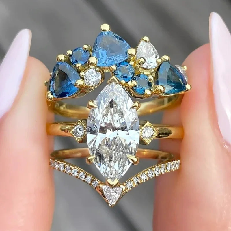 Woman's copper ring with intricate gemstone inlays, featuring detailed craftsmanship and elegant design.
