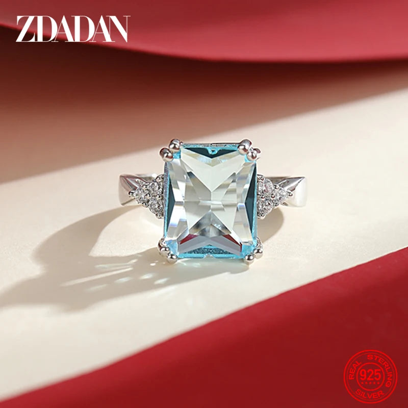Silver aquamarine gemstone ring by ZDADAN featuring multiple sparkling stones, designed for women.