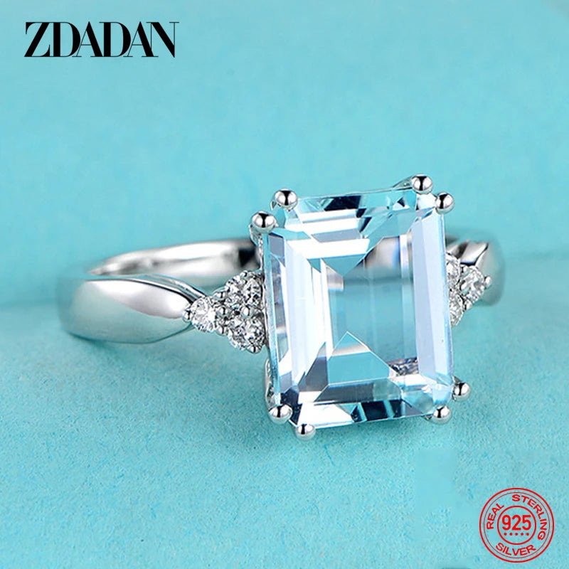 Elegant ZDADAN aquamarine gemstone ring for women featuring sparkling blue stones and intricate silver band design.