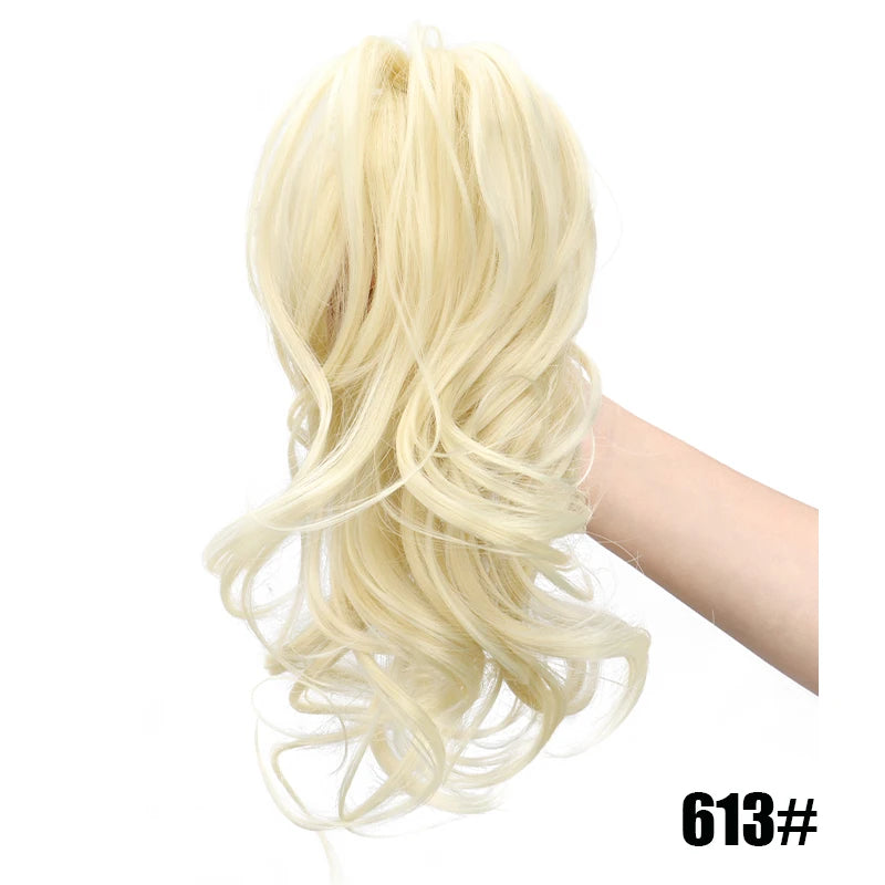 Short curly clip-in ponytail extension from Corporación Turística, 12 inches, natural black hair, attached with a secure clip.