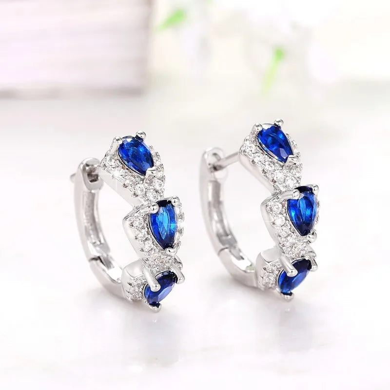 Sterling silver hoop earrings with cubic zirconia stones, stylish jewelry by Corporación Turística