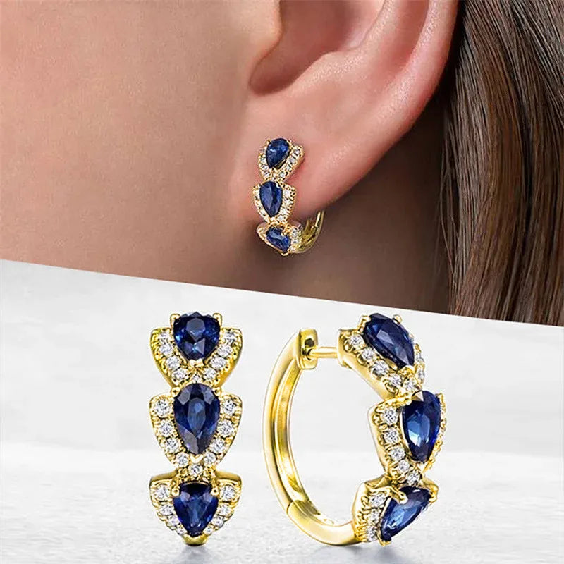 Blue cubic zirconia hoop earrings for women, stylish jewelry with sparkling stones, designed by Corporación Turística.