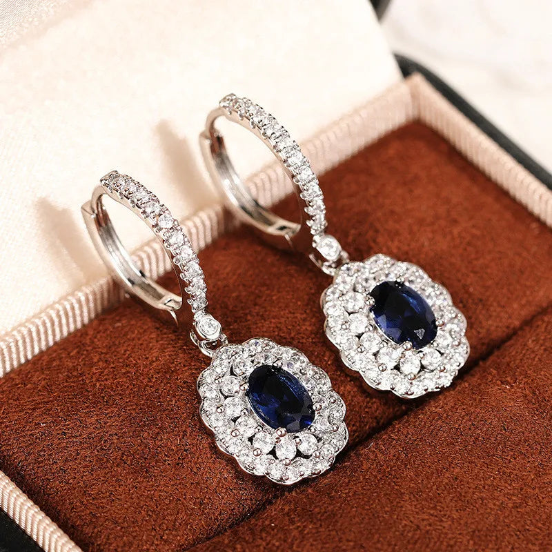 Sterling silver 925 dangling earrings with gemstone inlay, stylish jewelry by Corporación Turística.