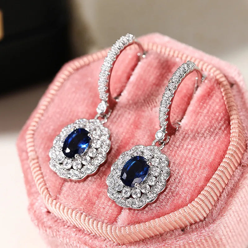 Sterling silver 925 dangling earrings with gemstone inlay, elegant jewelry by Corporación Turística