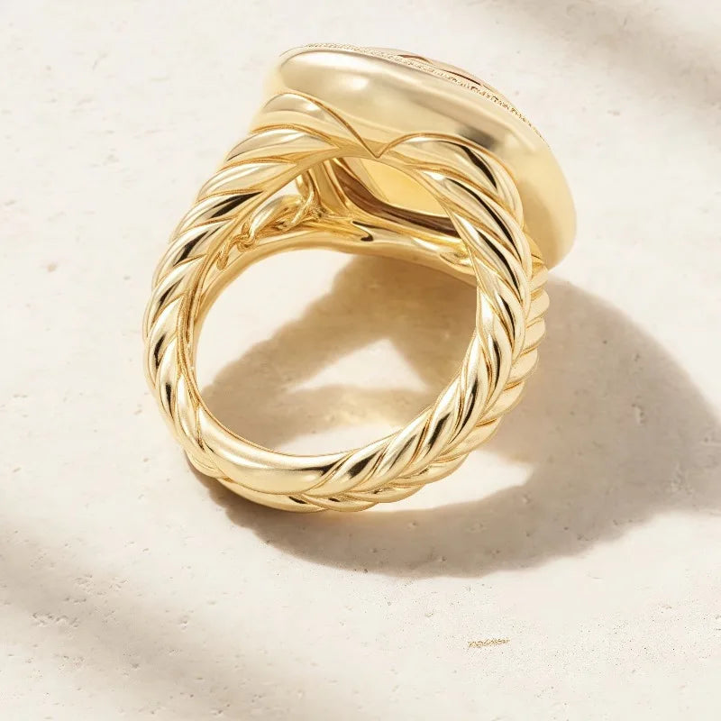Luxurious zircon ring with square-inset stones, crafted by Corporación Turística, showcasing sparkling jewelry design.