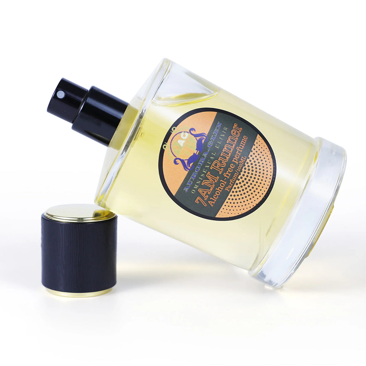 Essential oil spray with woody spicy fragrance by Corporación Turística, featuring a sleek bottle and aromatic mist.