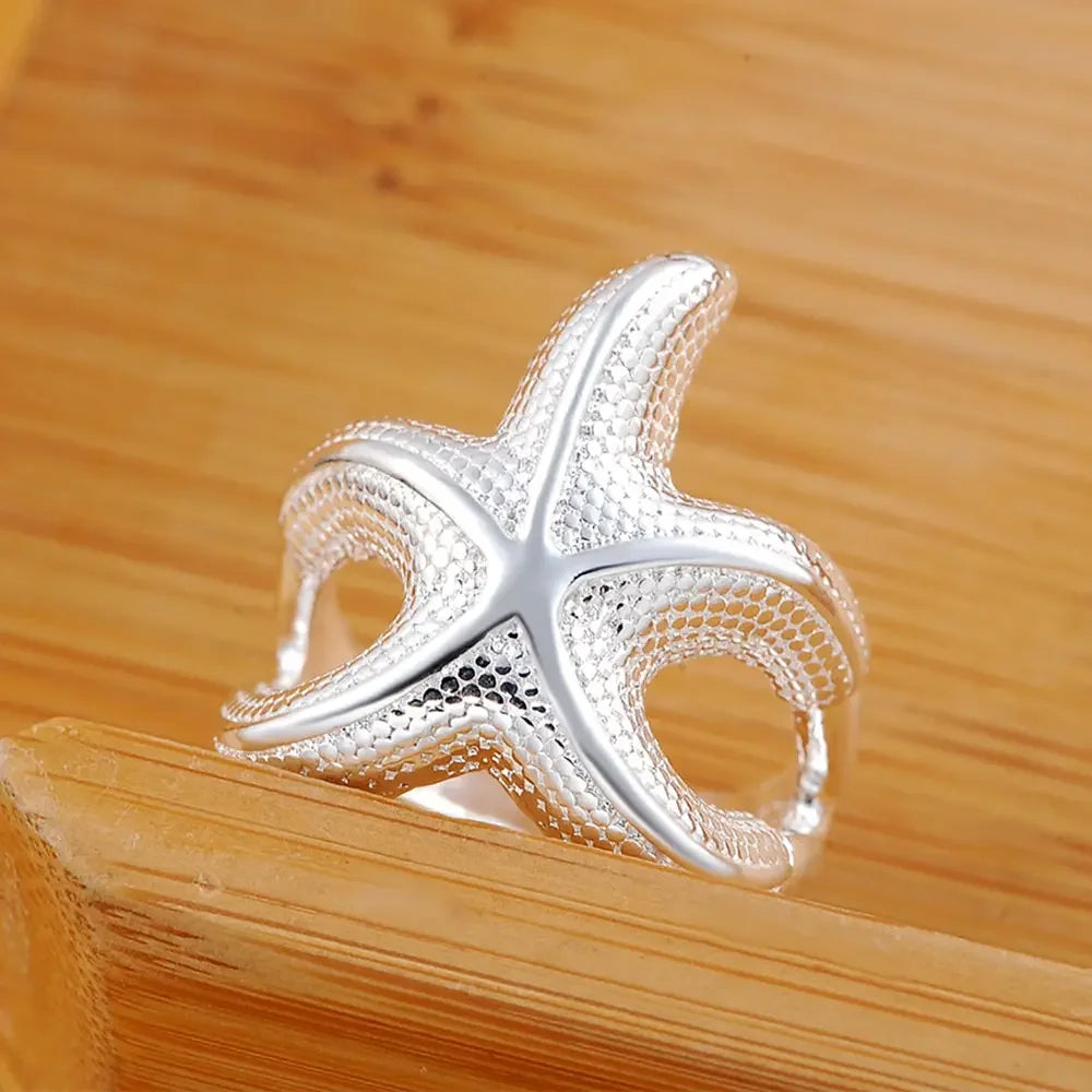 Large sterling silver starfish rings by Corporación Turística showcasing fine craftsmanship and intricate starfish design.