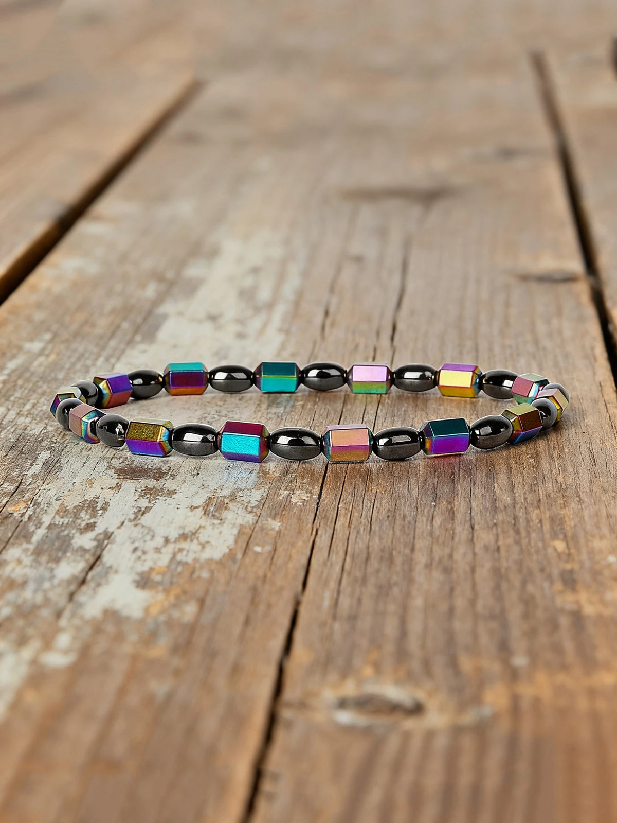Natural hematite bracelet with rectangular beads, 19cm length, featuring polished stone segments for elegant wristwear.