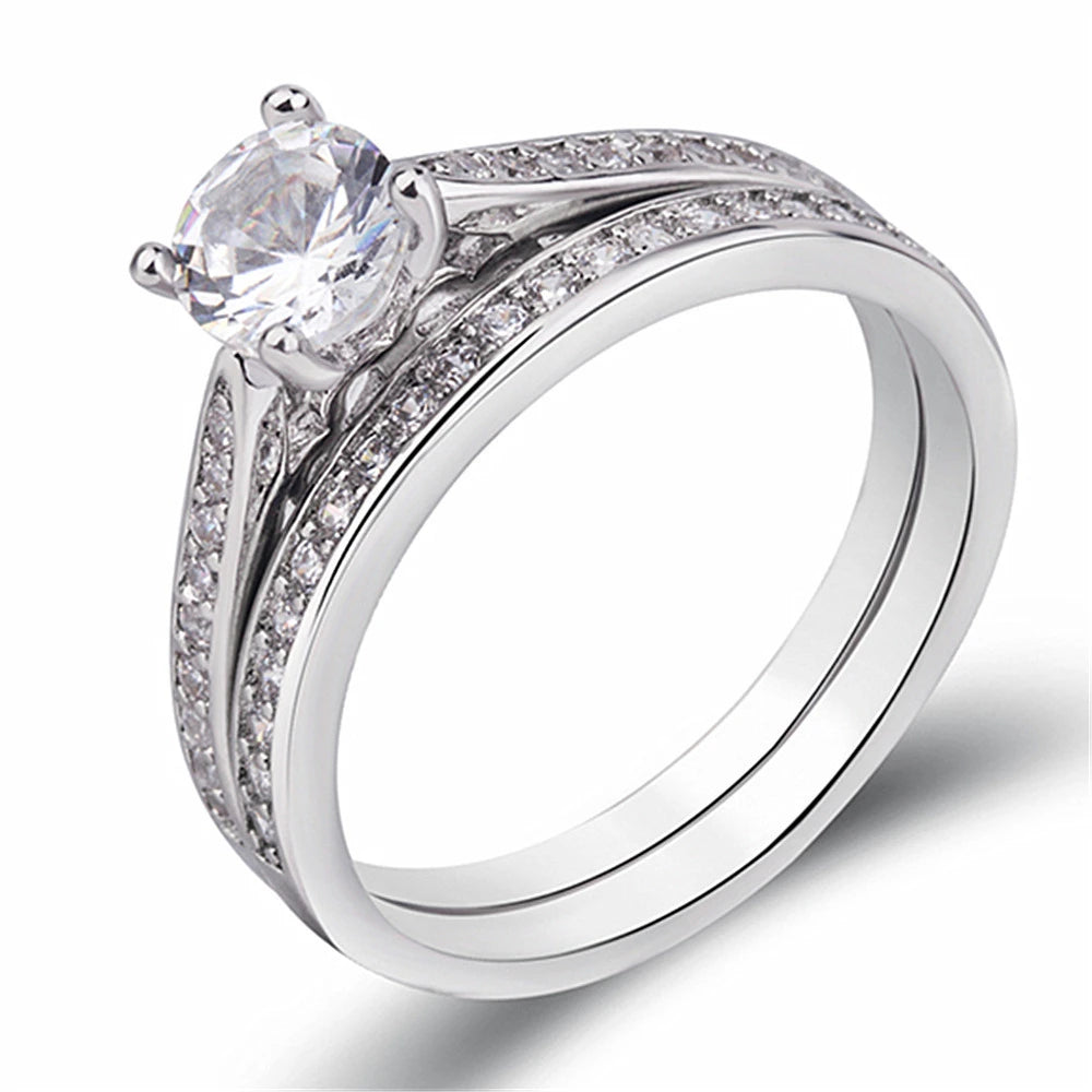 Sterling silver ring with zircon inlays, crafted by Corporación Turística, showcasing intricate design and sparkling accents.