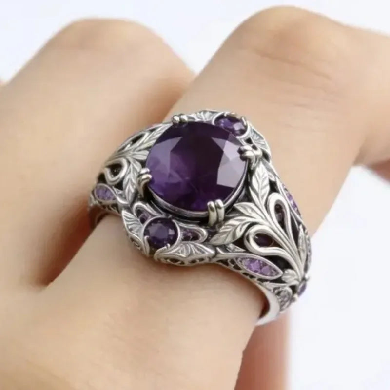 Retro fashion ring with purple cubic zirconia accents, showcasing a stylish design and sparkling gemstone details.
