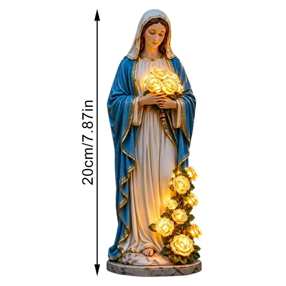 Decorative Virgen María garden statue with roses, illuminated for outdoor religious display by Corporación Turística.