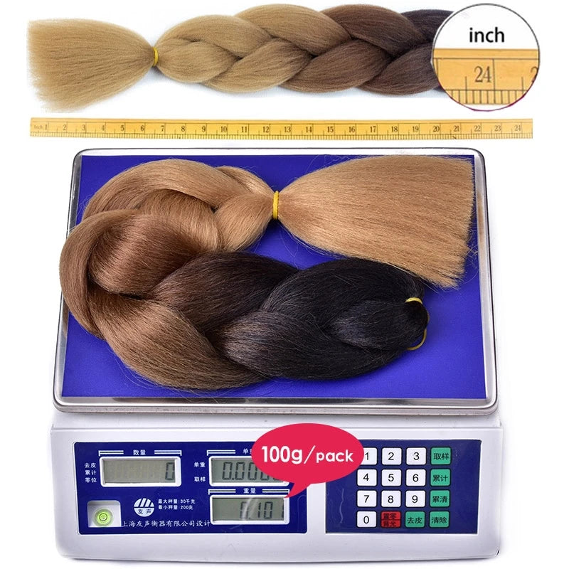 24-inch synthetic ombré braided hair extension from Corporación Turística, shown in a close-up of the textured, multi-tonal braid.