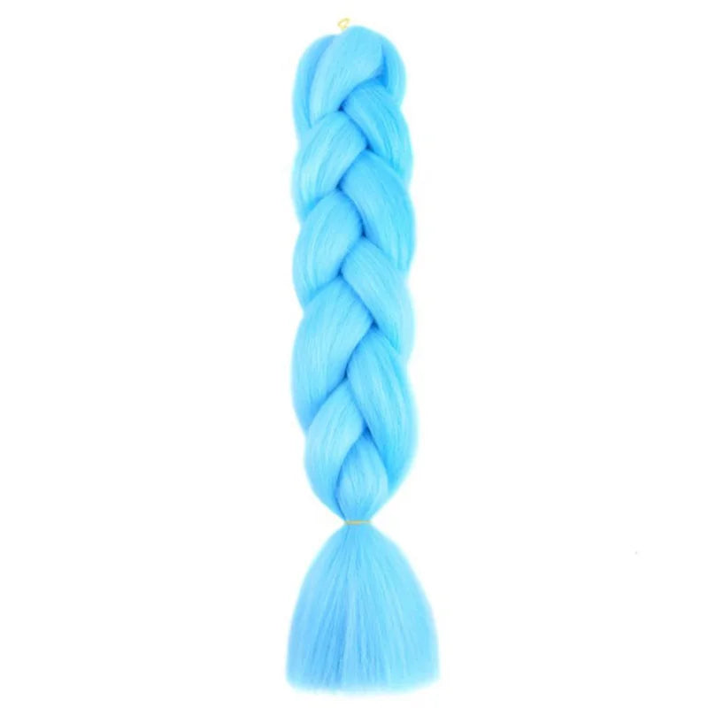 Long synthetic Yaki trenza hair extensions, 24 inches, straight, from Corporación Turística, shown in a close-up image.