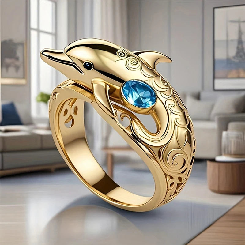 Gold dolphin design finger rings for women, featuring intricate dolphin motifs, by Corporación Turística.