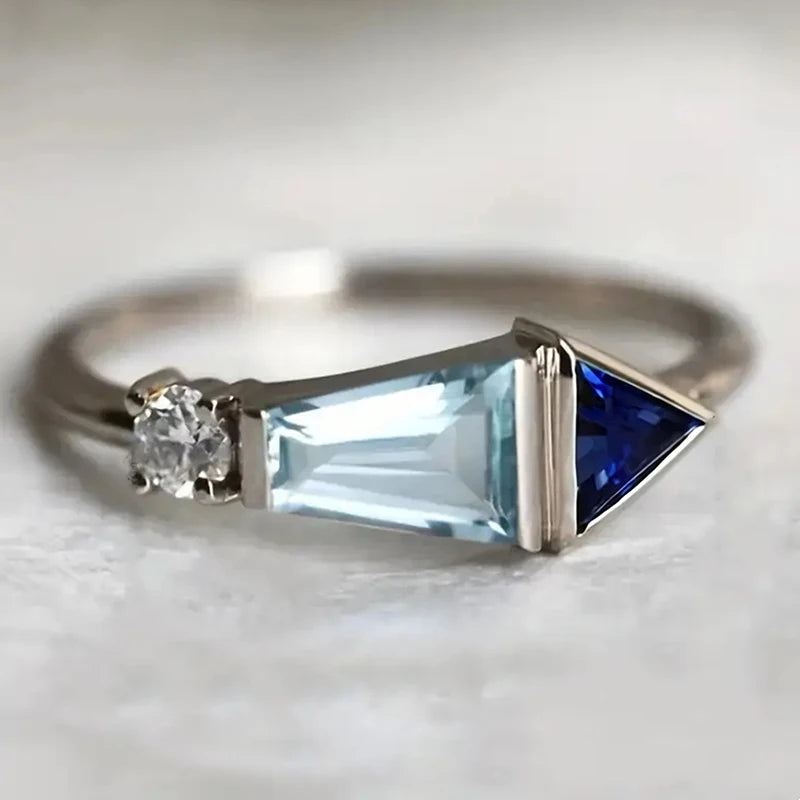 Blue cubic zirconia Huitan finger ring from Corporación Turística featuring a geometric design and silver-tone finish.