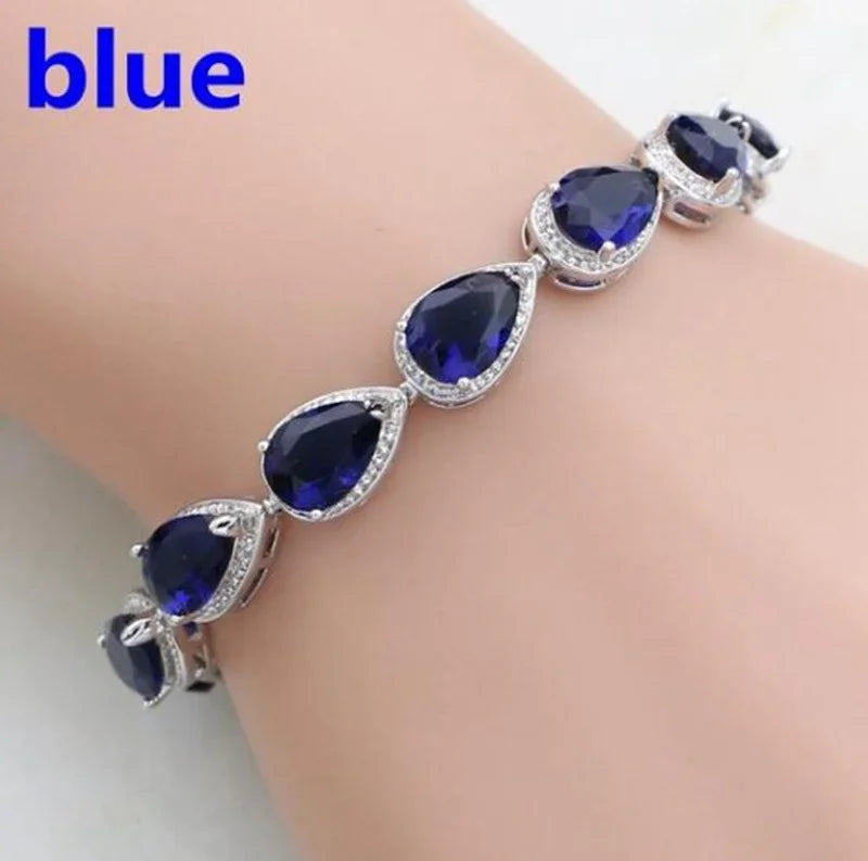 Elegant fashion crystal gemstone bracelet with colorful rainbow stones, designed by Corporación Turística for a stylish look.