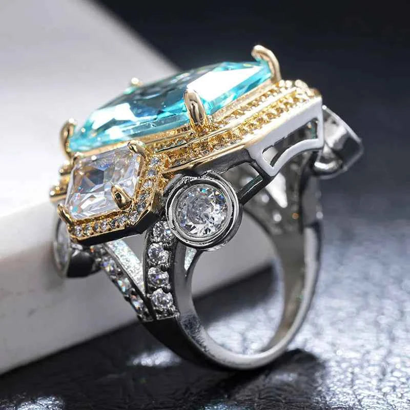 Blue cubic zirconia rectangular rings from Huitan, crafted by Corporación Turística, featuring shiny faceted design and silver-tone bands.