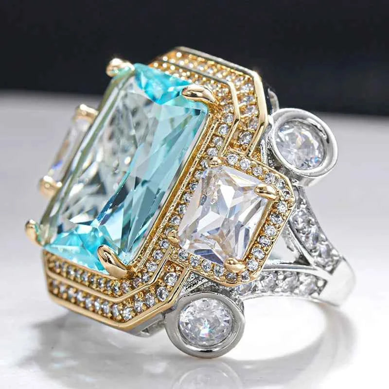 Blue cubic zirconia rectangular ring by Huitan, featuring a sleek design and silver-tone band from Corporación Turística.