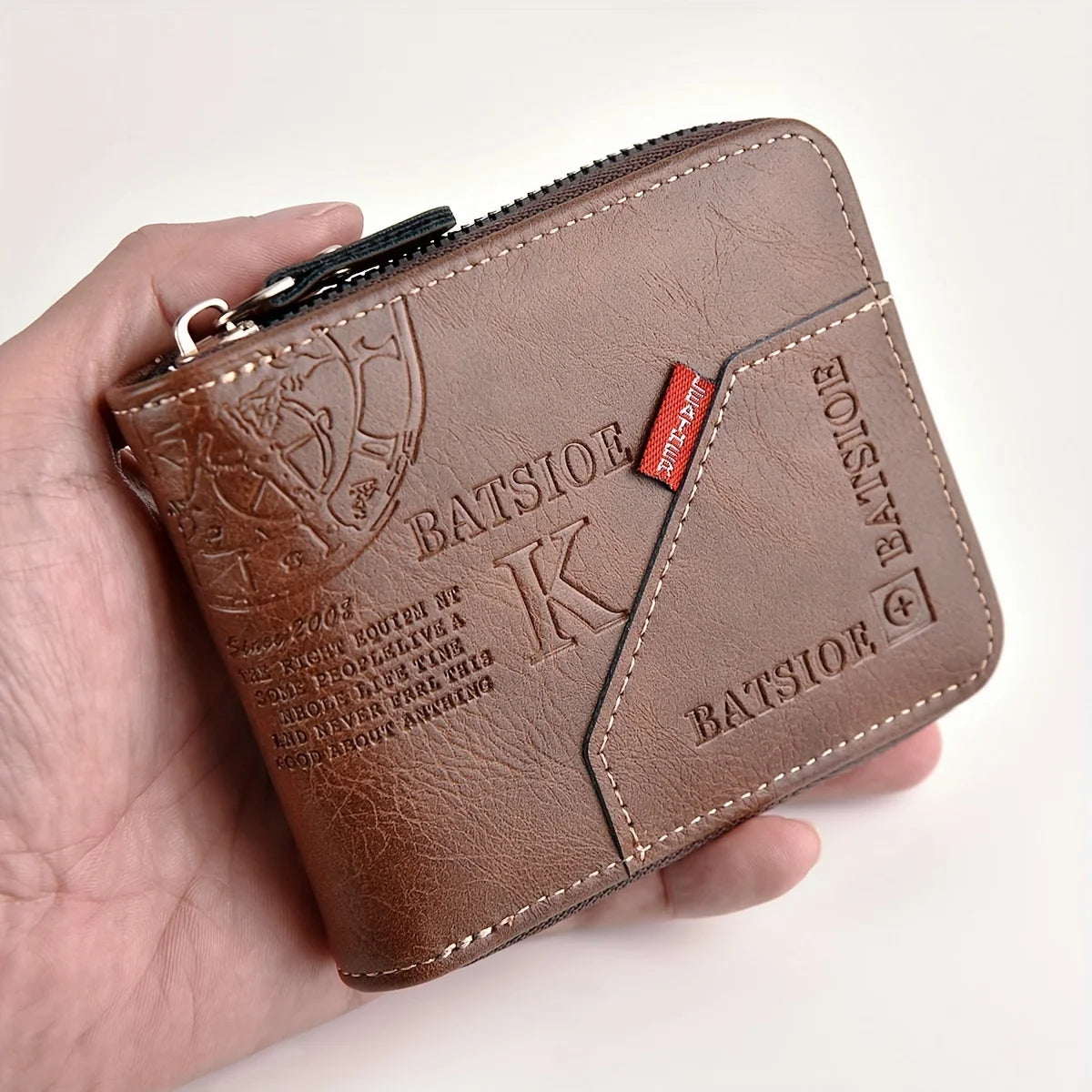 Black men's PU leather wallet with zipper, featuring coin pocket and card slots, from Corporación Turística.