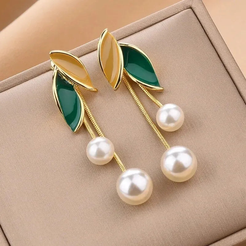 Pearl imitation dangle earrings for women, featuring elegant drop design, by Corporación Turística.
