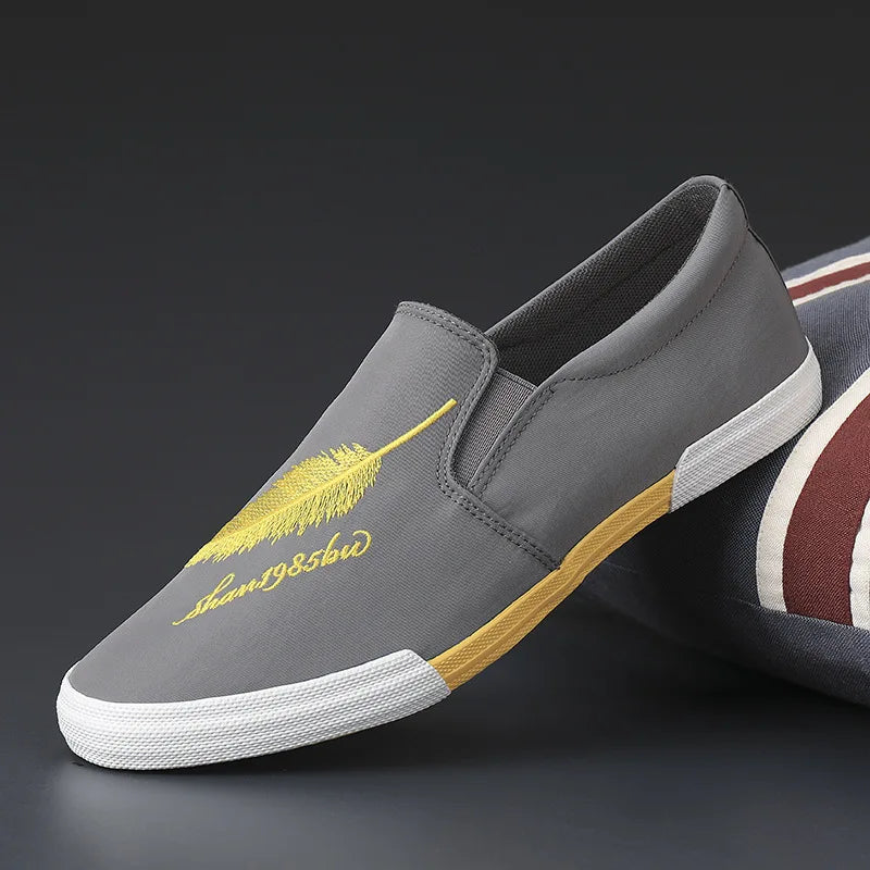 Casual men's fabric shoes by Corporación Turística in yellow, featuring comfortable slip-on sneakers with a textile upper.