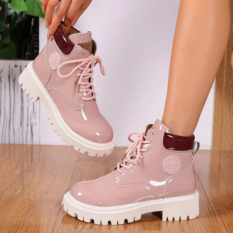 Apricot shiny patent leather lace-up women's boots with pointed toes, stylish and sleek footwear by Corporación Turística.