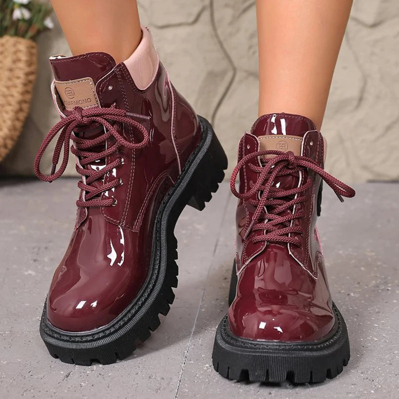 Apricot women's patent leather lace-up ankle boots with pointed toes, stylish and shiny for fashionable footwear.