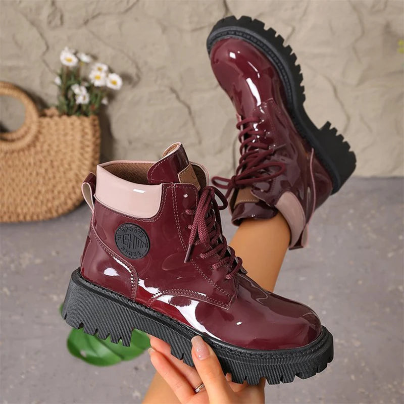 Apricot women's patent leather lace-up boots with pointed toes, stylish and shiny for fashionable footwear.