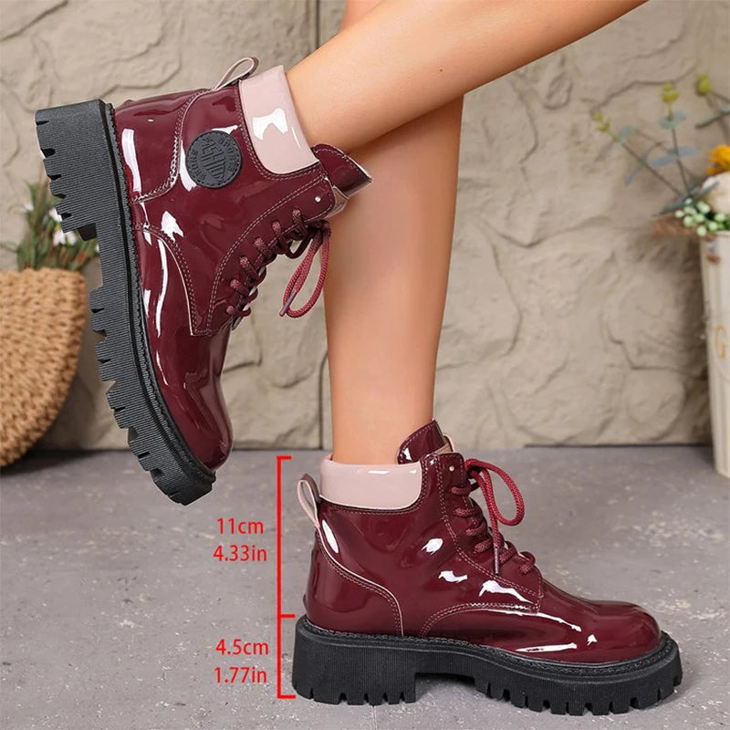 Apricot shiny patent leather women's lace-up boots with pointed toes from Corporación Turística, stylish and elegant footwear.