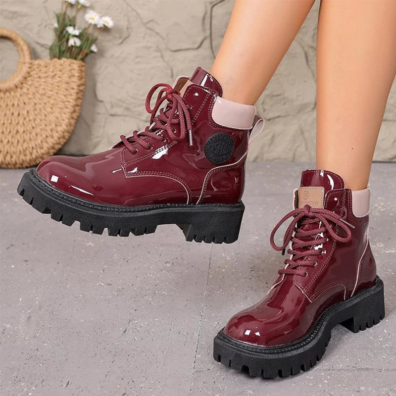 Apricot shiny patent leather lace-up women's boots with pointed toes by Corporación Turística, stylish and modern footwear.