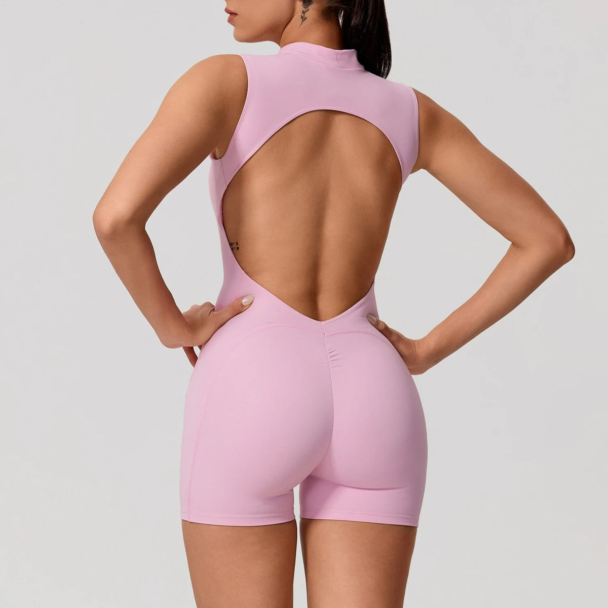 Light orange women's summer sleeveless sports jumpsuit by Corporación Turística, casual athletic romper for warm weather.