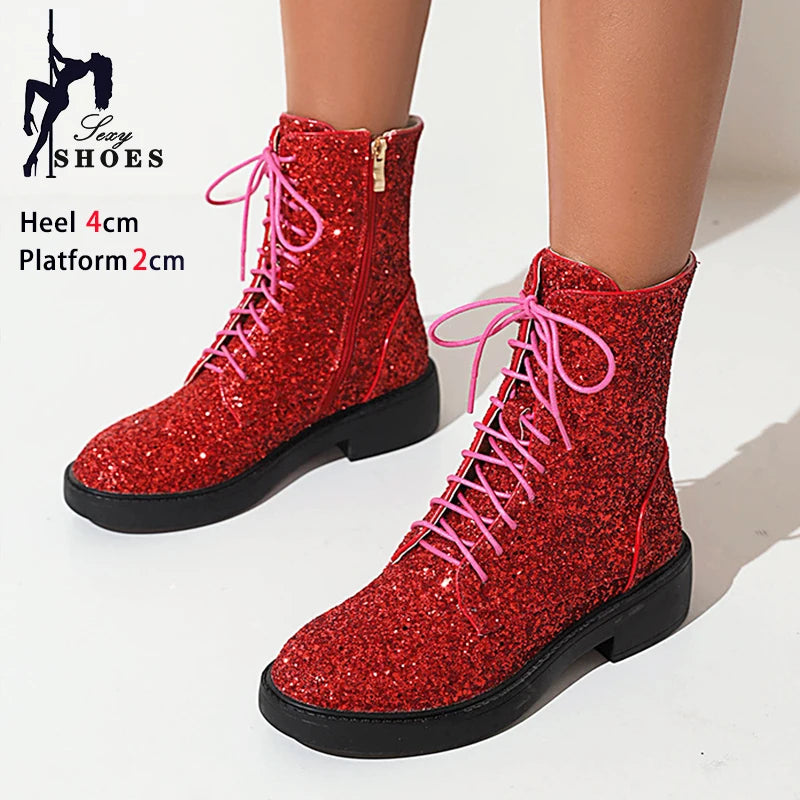 Bright shiny women's short boots by Corporación Turística, casual footwear with a sleek, polished finish.