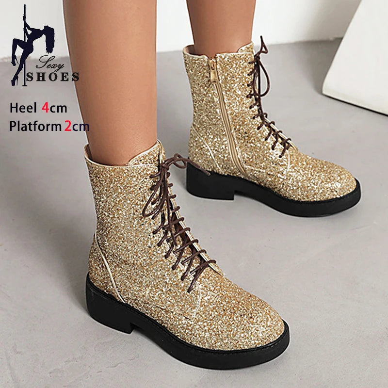 Bright shiny short boots for women by Corporación Turística, casual footwear with a sleek, stylish appearance.