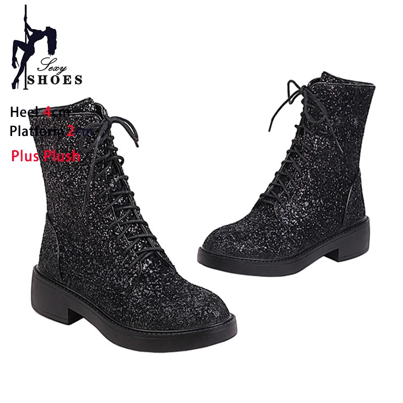 Bright, shiny women's short boots from Corporación Turística featuring casual, stylish black leather design.