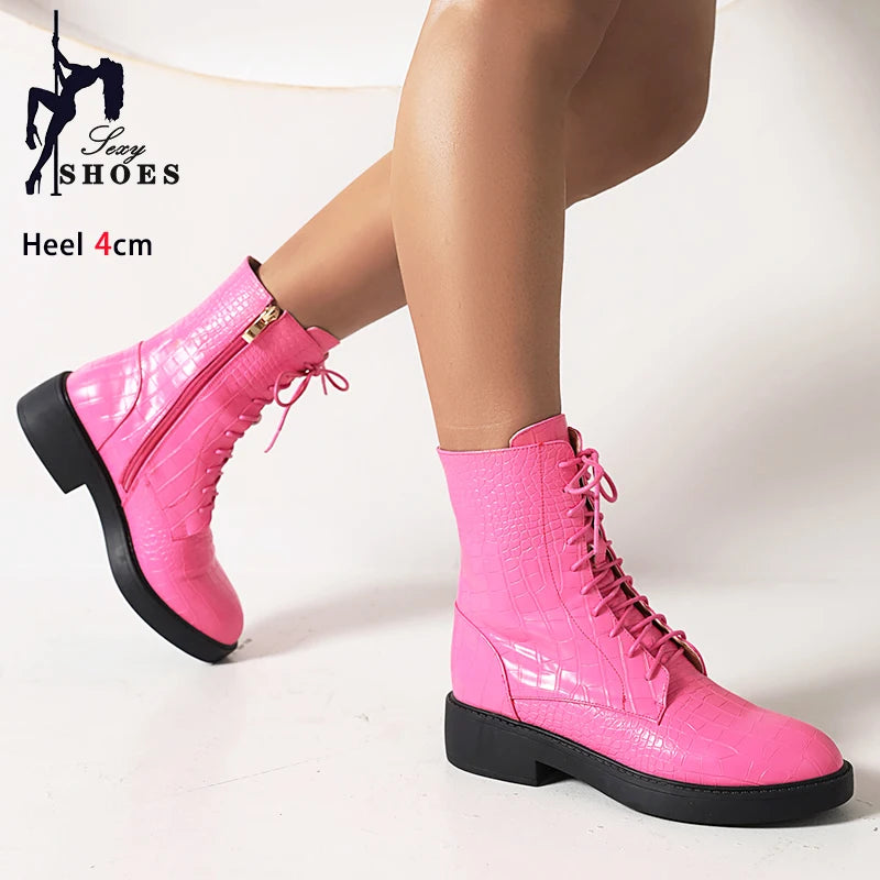 Pair of women's ankle boots with side zipper from Corporación Turística, featuring a sleek design and stylish finish.