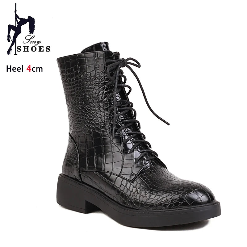 Lateral zipper women's boots by Corporación Turística featuring stylish design and ankle-high length in black leather.