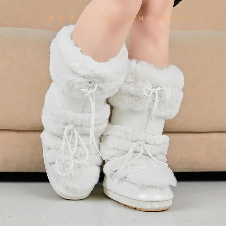 Women's snow boots with thick synthetic leather soles and stylish design, ideal for winter weather.