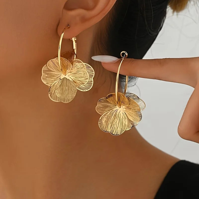 Elegant vintage double petal earrings for women, featuring intricate gold-tone design and floral details.
