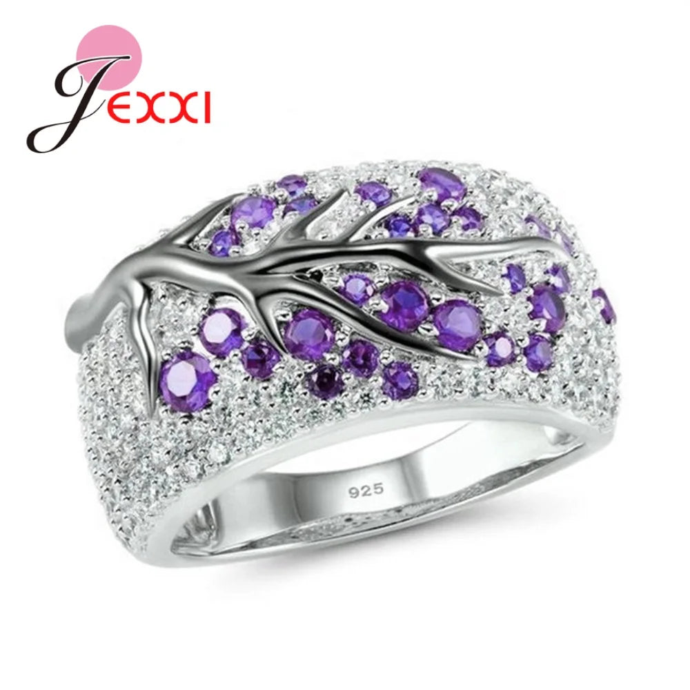 Blue floral plum blossom paper rings from Corporación Turística, showing detailed patterns and vibrant colors on a white background.