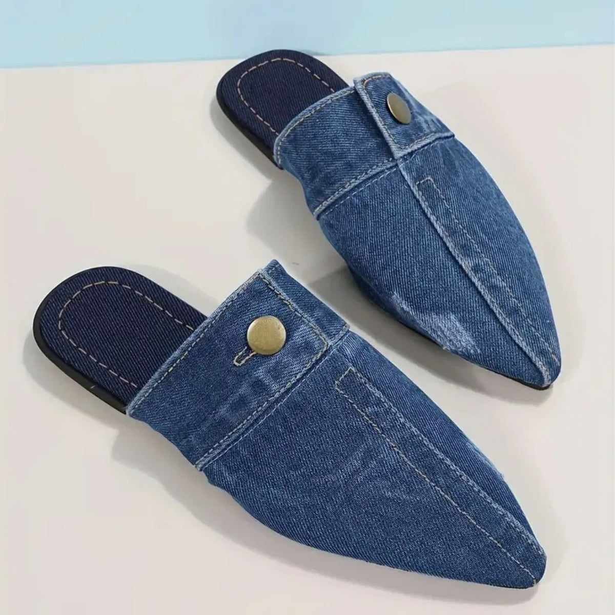 Comfortable and versatile women's sneakers in blue by Corporación Turística, shown in a close-up view.