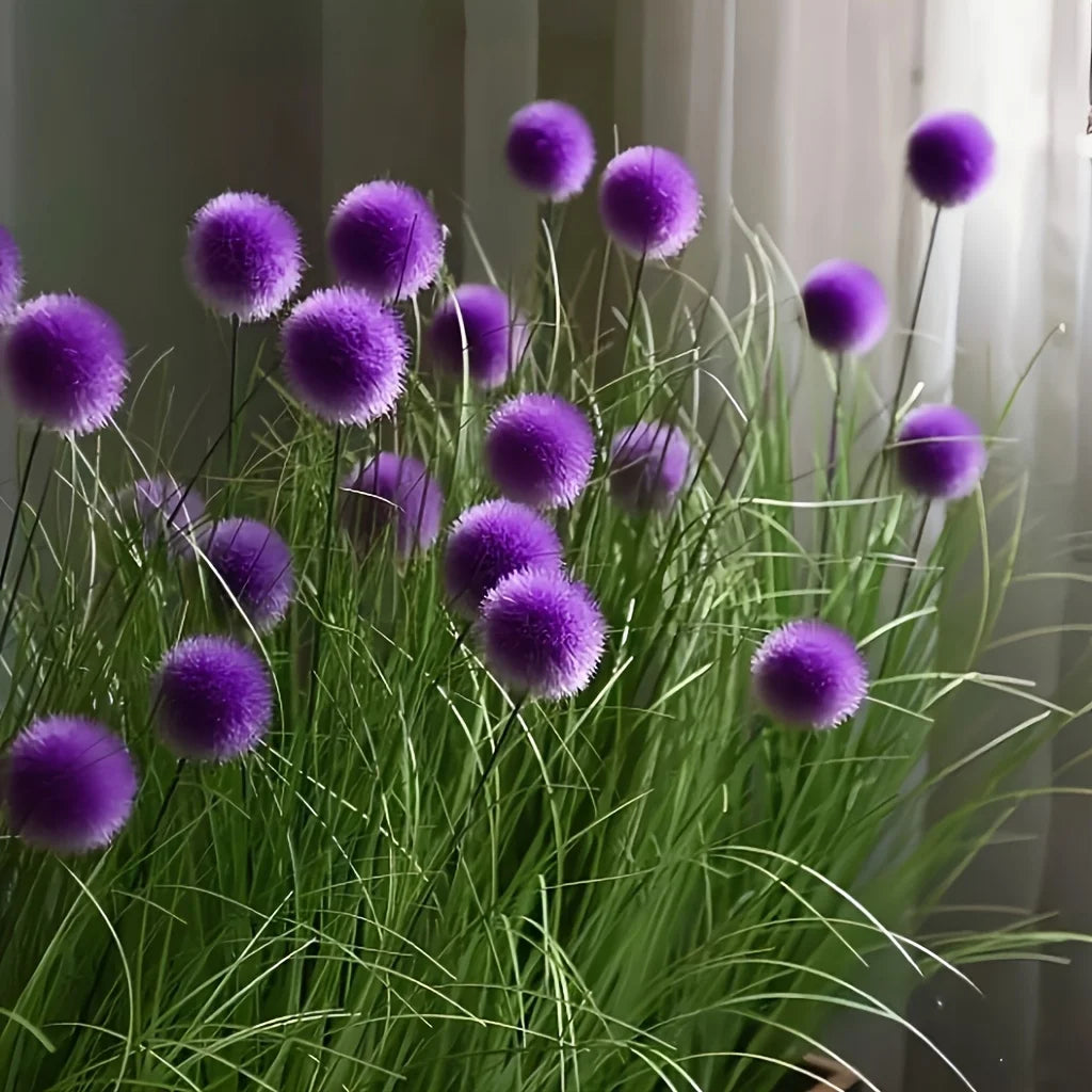 Set of five artificial purple bulbous grass plants by Corporación Turística, realistic and vibrant for decorative use.