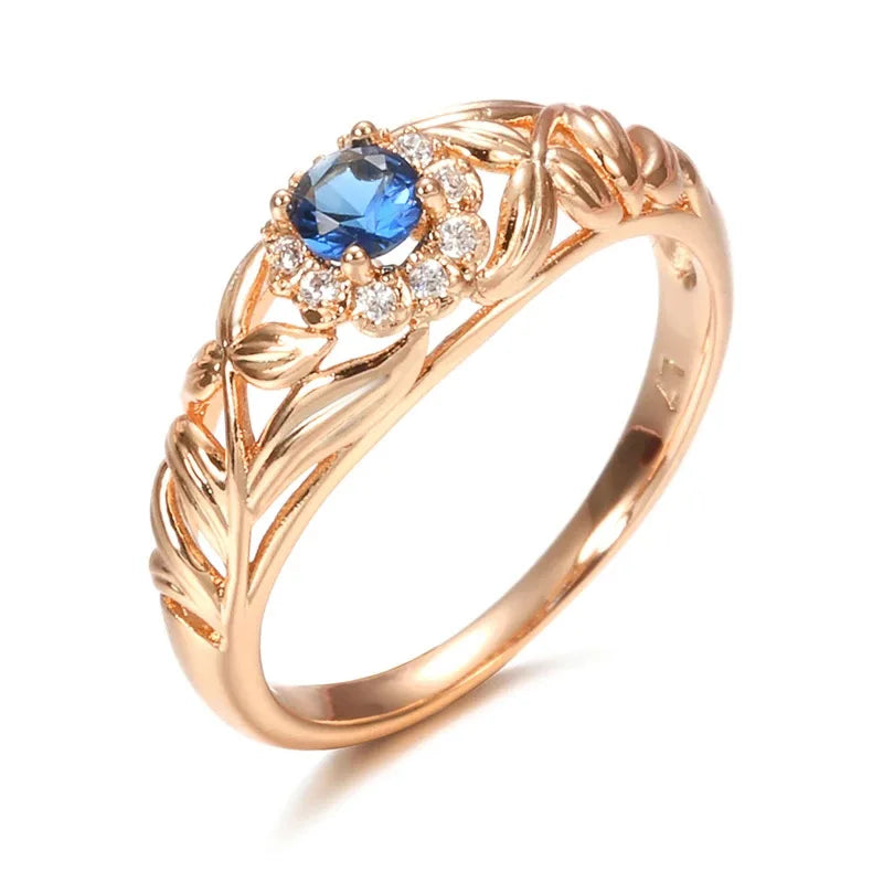 14k gold women's ring with sparkling diamonds, featuring a blue gemstone accent, from Corporación Turística.