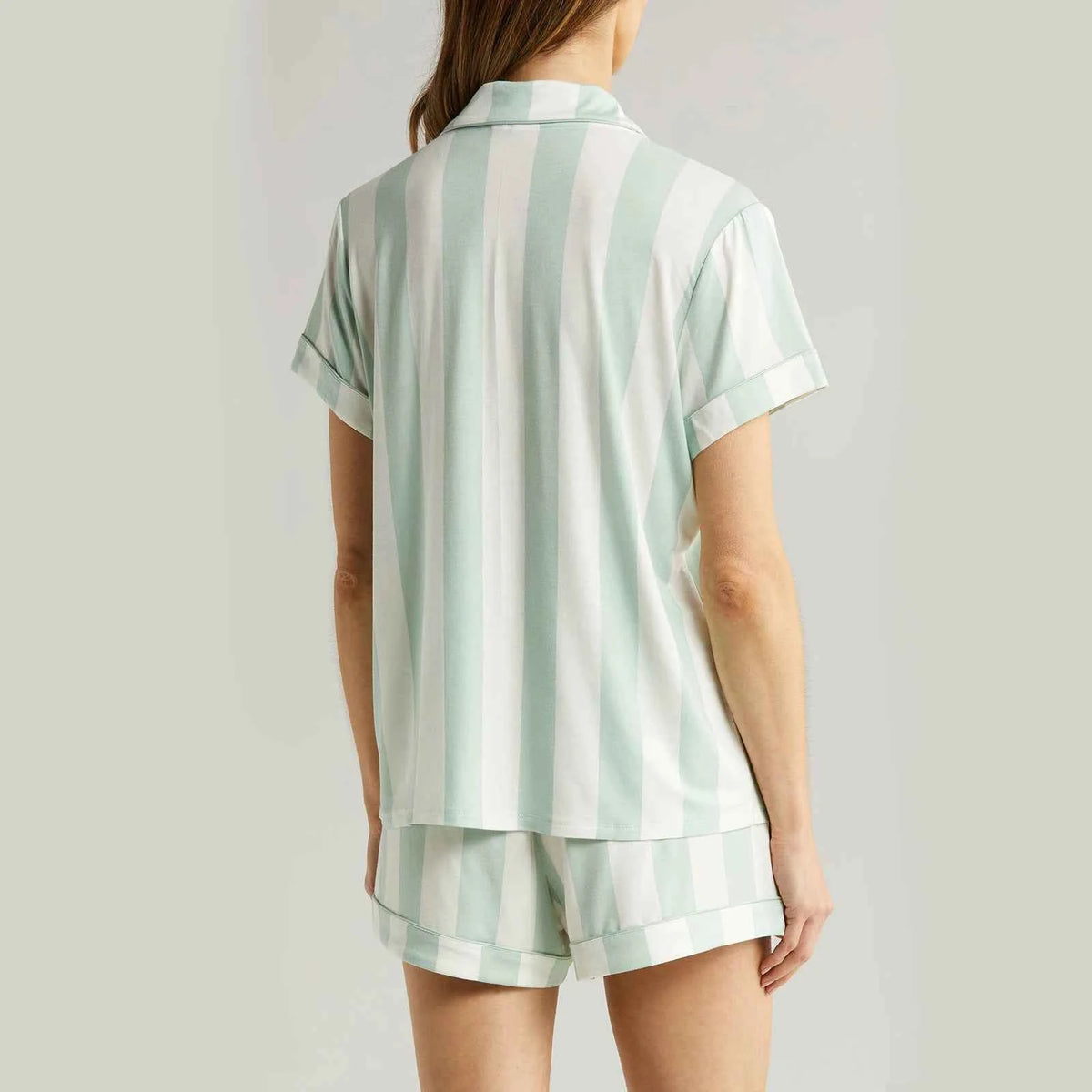 Light blue short-sleeve women's pajama set by Corporación Turística, soft fabric, comfortable sleepwear for women.