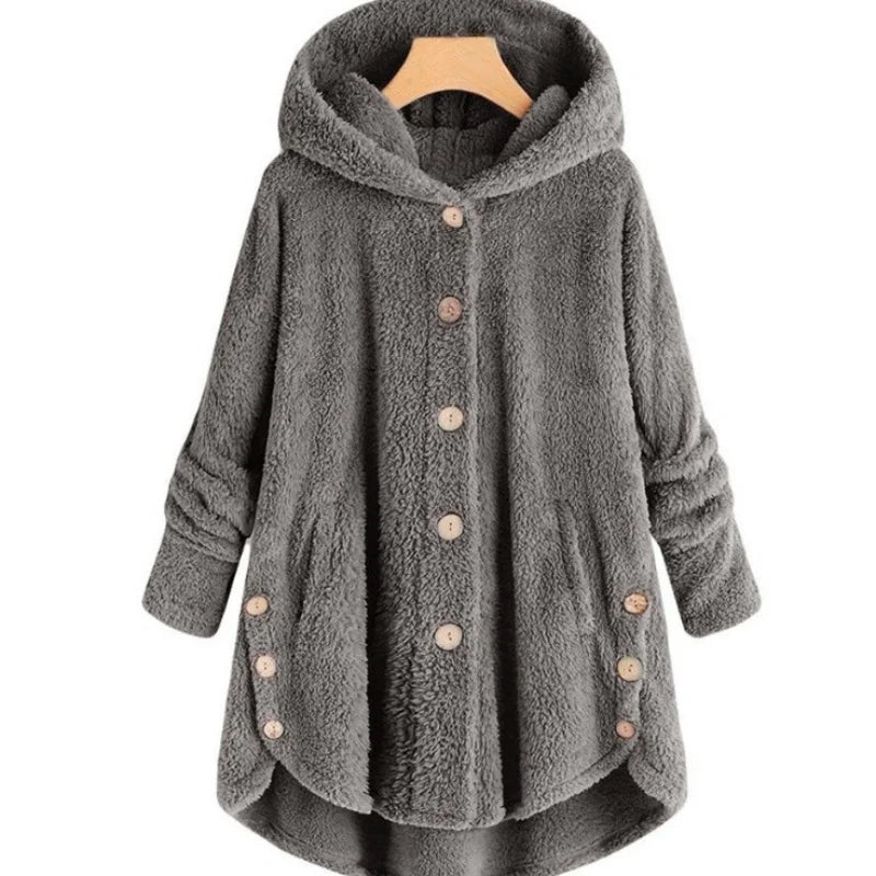 Light blue solid button-up autumn winter coat from Nueva moda Otoño Invierno by Corporación Turística, shown on a hanger.