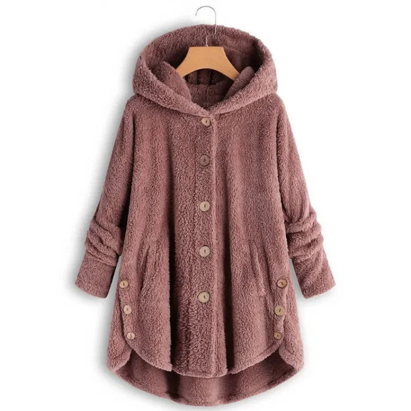 Light blue women's fall and winter coat by Corporación Turística, showing the warm, cozy fabric and stylish design.