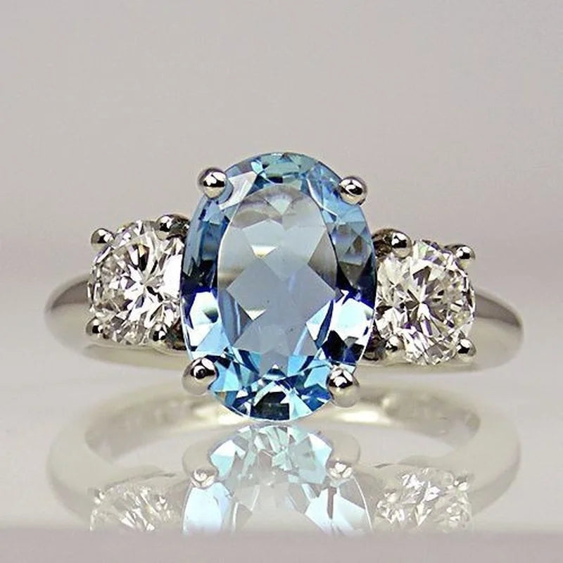 High-quality Aquamarine mood ring by Corporación Turística, featuring deep blue gemstone and sleek silver band.