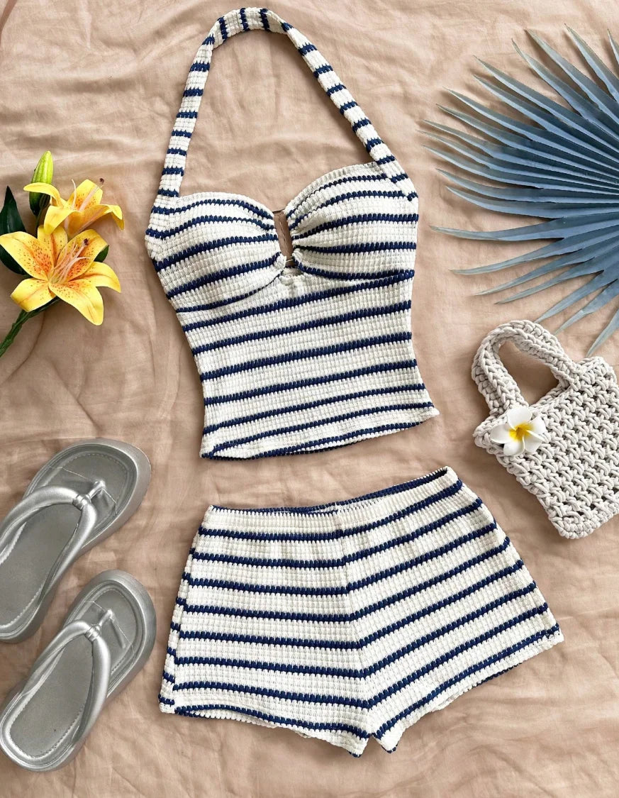 Blue summer two-piece set with halter top and knit design, by Corporación Turística, shown on a model.